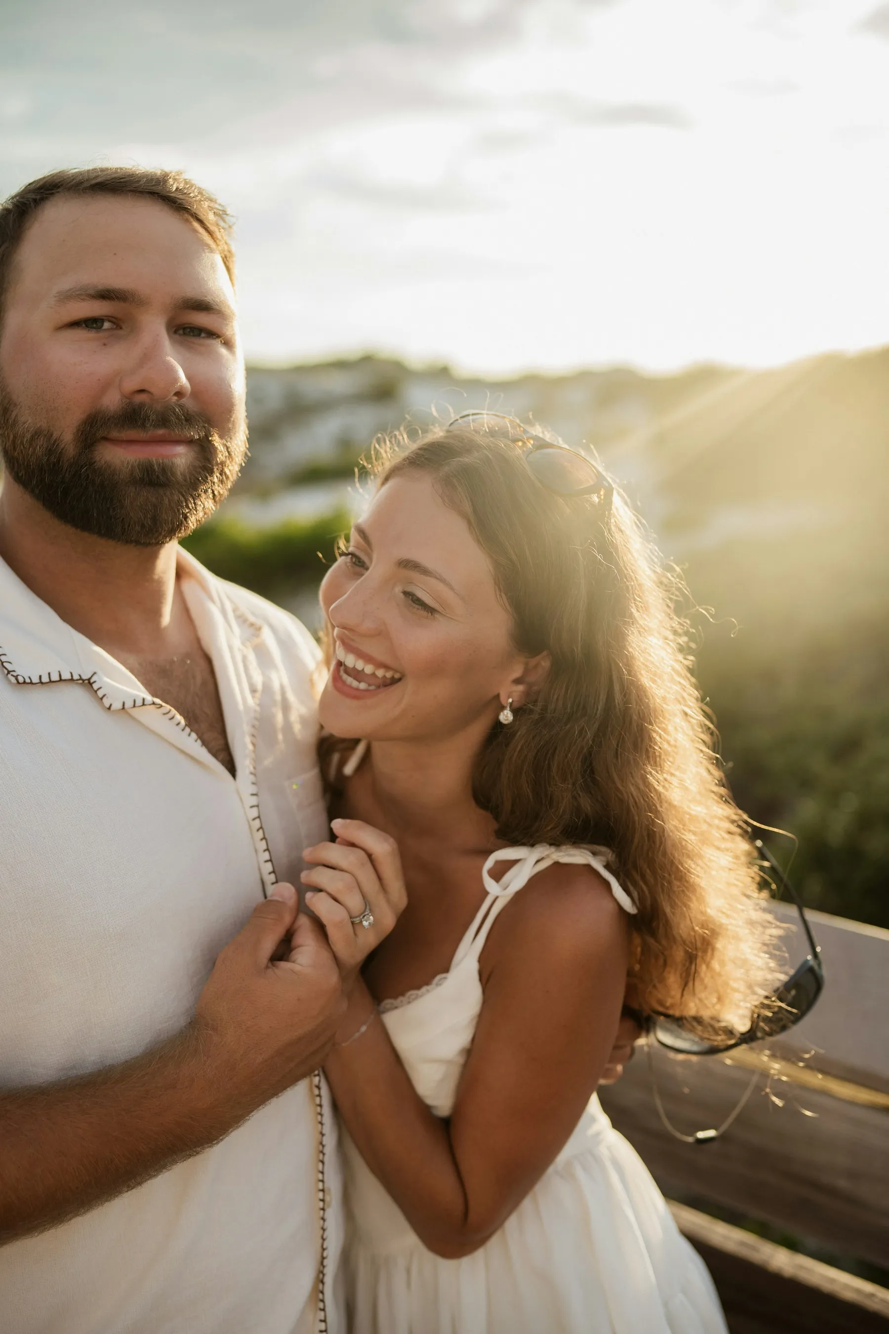 A couple laughing together in golden evening light