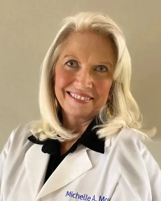 Michelle Mourre, NP, in her white coat